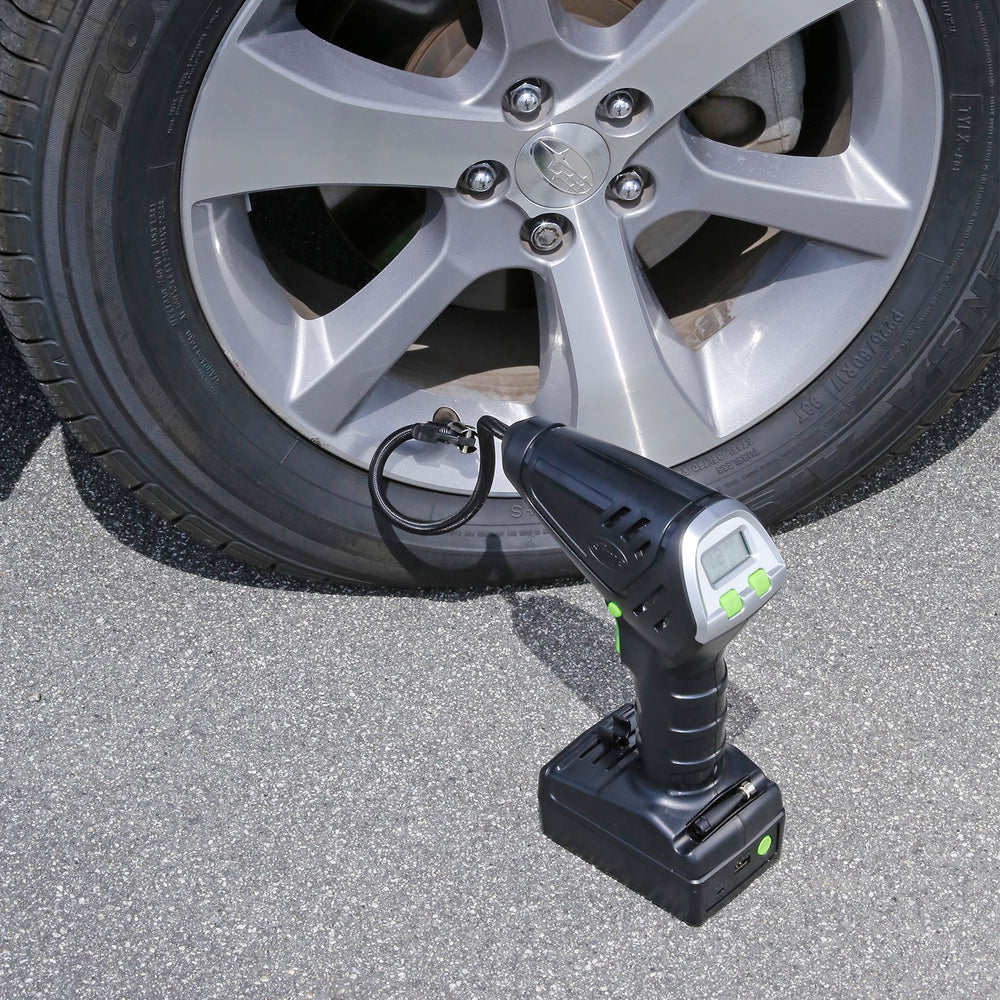 Slime Cordless Tire Inflator #40057 Connected to Tire and Placed on Ground