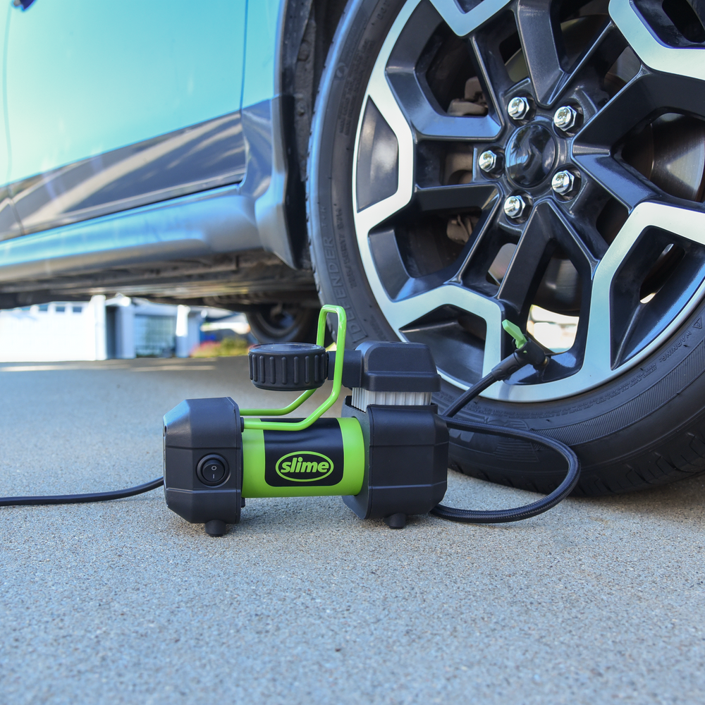 
            
                Load image into Gallery viewer, Slime 120V Pro Power Tire Inflator #40045 In Use on Car
            
        