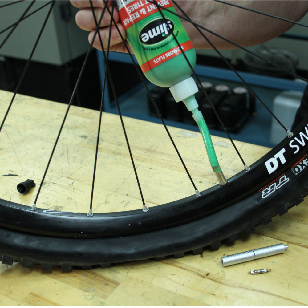 
            
                Load image into Gallery viewer, Slime Tube Sealant - 8 oz. #10003 Install in Bicycle Tire
            
        